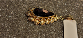 14 kr gouden hanger met granaat bruto 3,5 gram 3.5 bij 1.8 cm.