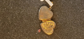 14 kr gouden medaillion model hard nette staat 2 cm 2,3 gram.
