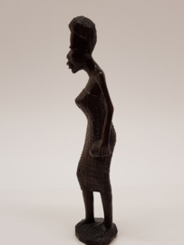 Wooden statuette of a Surinamese lady.