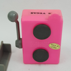 Pencil sharpener and fridge magnet in the form of a slot machine