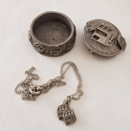 Pewter jewelry box with various jewelry