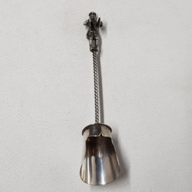 Antique silver plated sugar spoon with a man on top