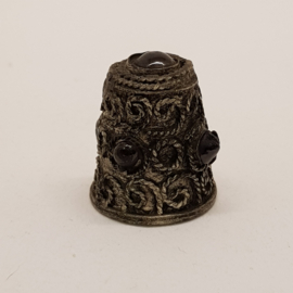 Antique thimble with minerals
