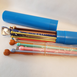 Knitting needles in plastic retro blue tube