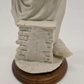 A Belcari statue of a girl with ducklings