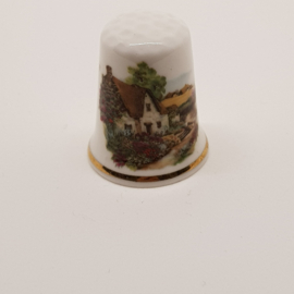Thimble with a mansion