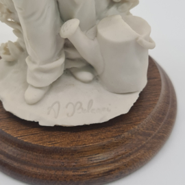 A Belcari statue of a boy with a fruit basket