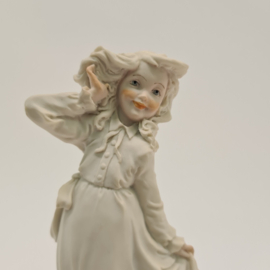 A Belcari statue of a girl with ducklings