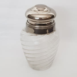 Shaker with silver colored lid