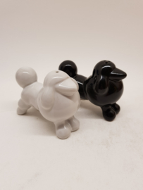 Poodles black and white as salt and pepper shakers