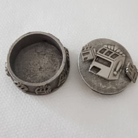 Pewter jewelry box with various jewelry