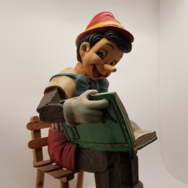 Pinocchio wood on chair (probably missing Jiminy)