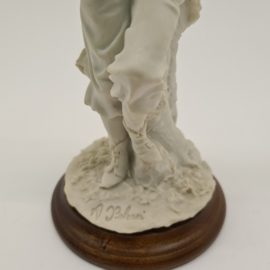 A Belcari statue of a boy with a fruit basket