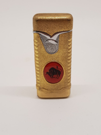 Gold-colored lighter with Taurus on it