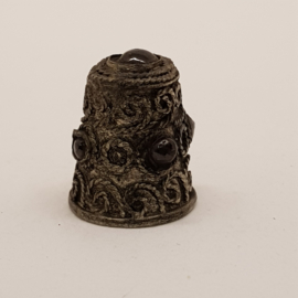 Antique thimble with minerals