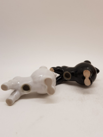 Poodles black and white as salt and pepper shakers