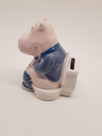 Hippopotamus sitting on the toilet piggy bank