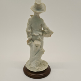 A Belcari statue of a boy with a fruit basket