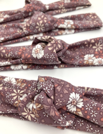Knoophaarband mauve met bloemen