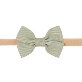 Klein babyhaarbandje met strikje groen