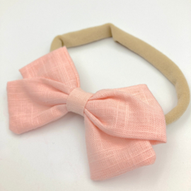 Babyhaarbandje met strik lichtroze
