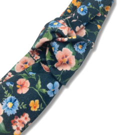 Knoophaarband donkerblauw met bloemen