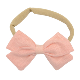 Babyhaarbandje met strik lichtroze