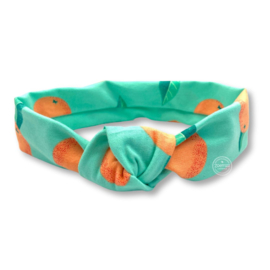 Groene haarband met sinaasappel