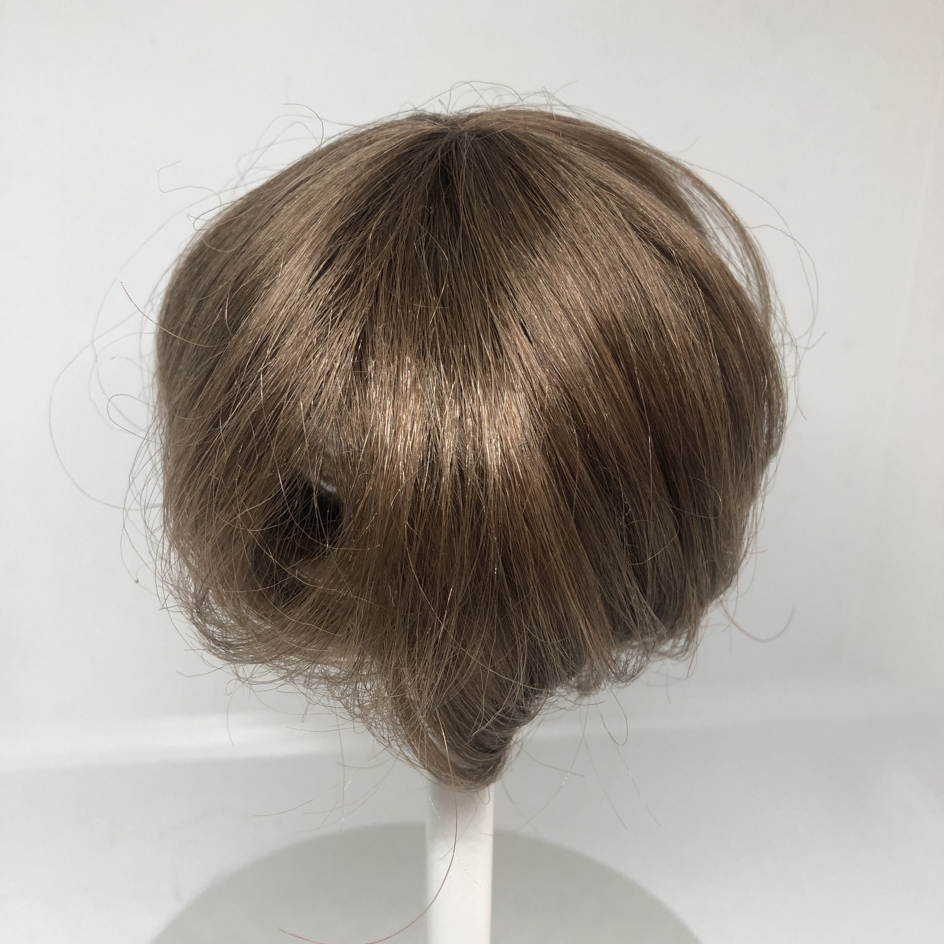Packhuys tressenkapje / haarstukje kunsthaar doorsnede 10  cm, bruin.