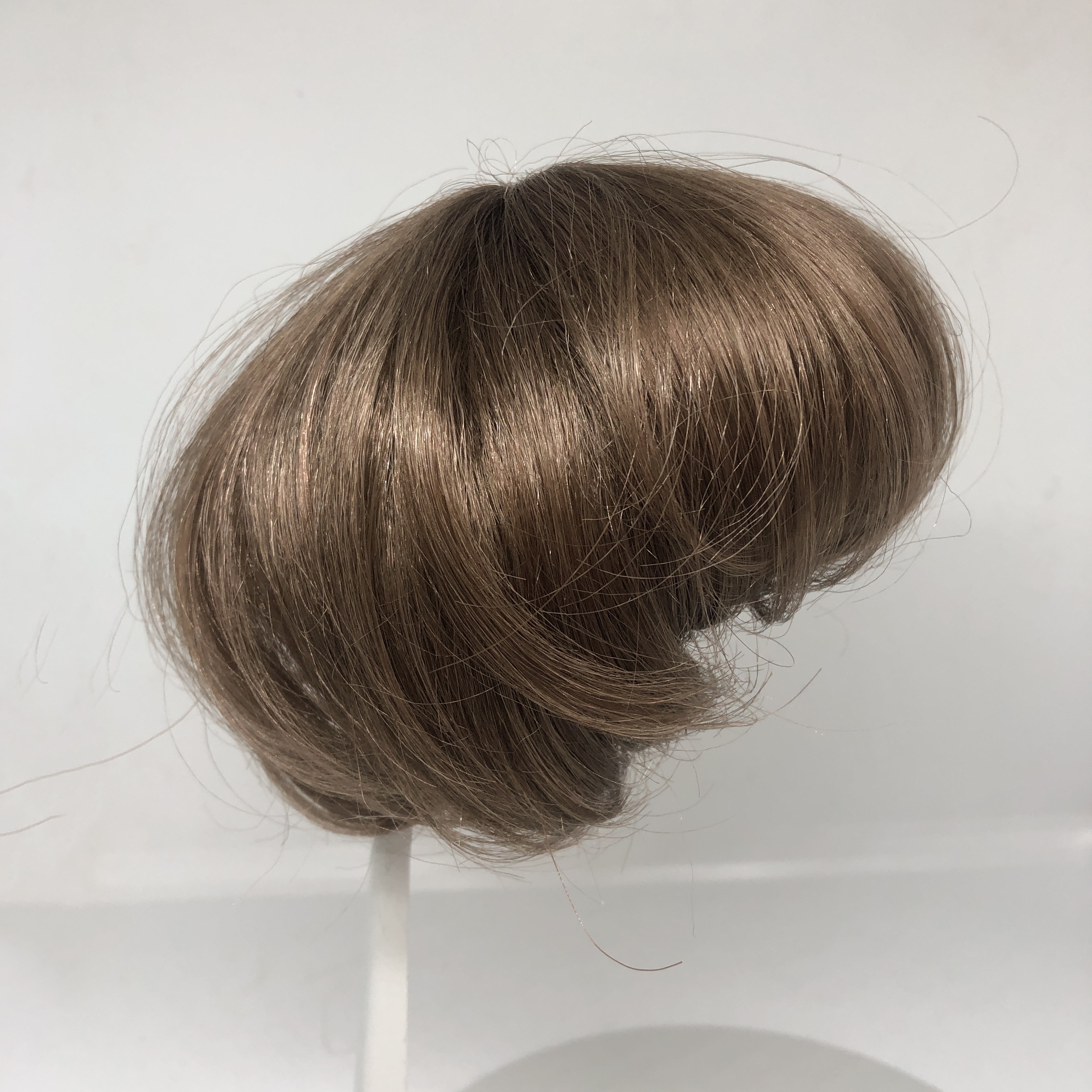 Packhuys tressenkapje / haarstukje kunsthaar doorsnede 10  cm, bruin.