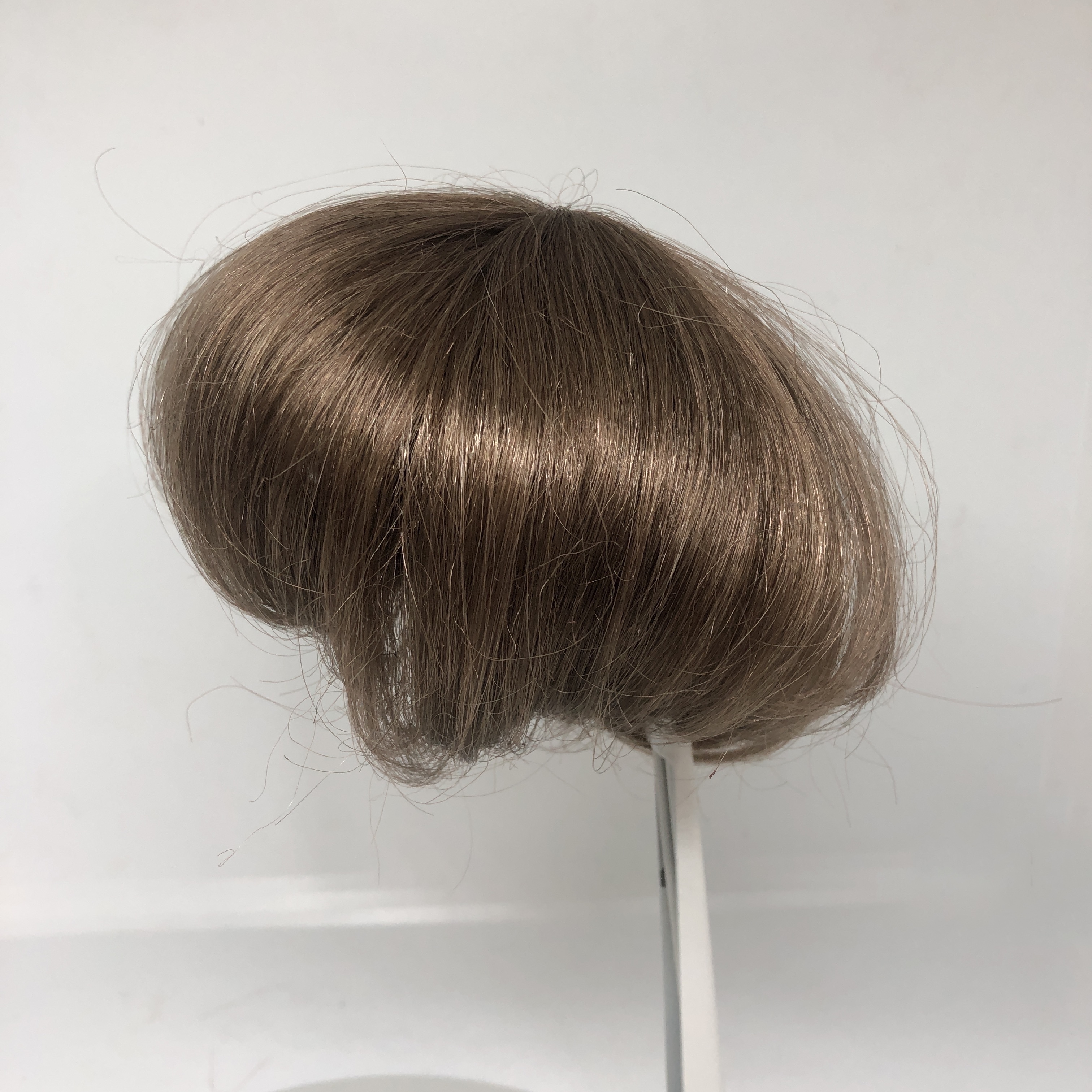 Packhuys tressenkapje / haarstukje kunsthaar doorsnede 10  cm, bruin.