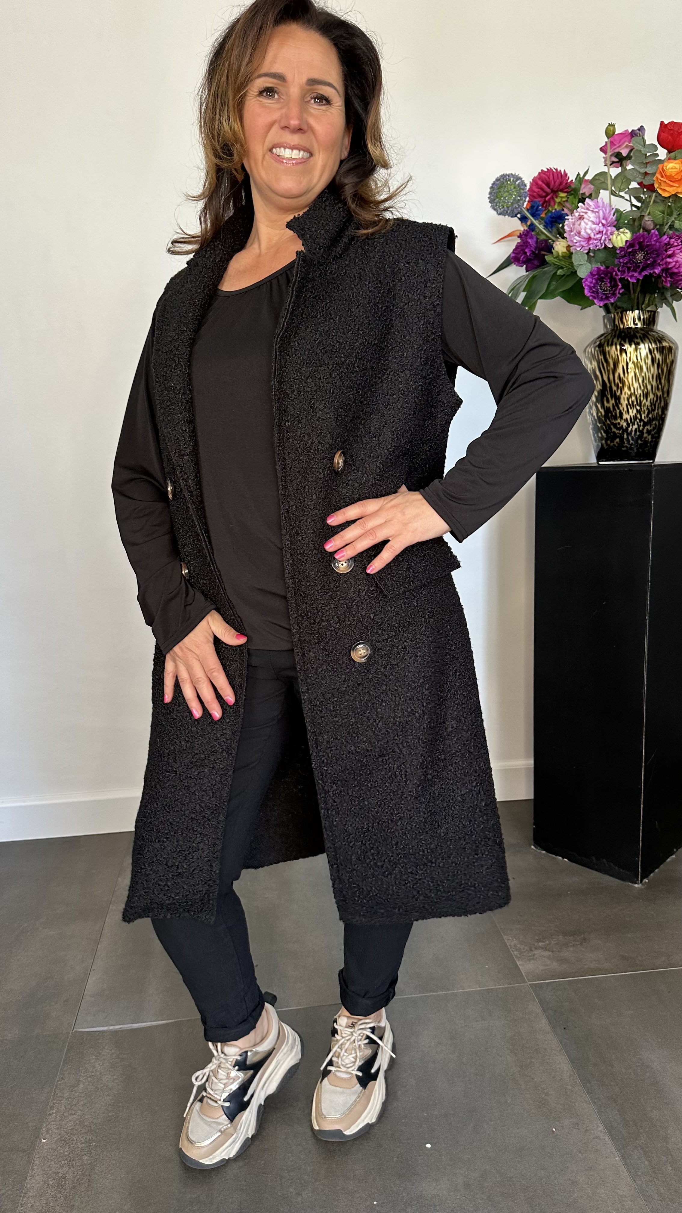 Lange teddy bodywarmer zwart