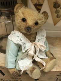 Hug Me Again Collectible bear "Channella" standing about 10" inch tall.