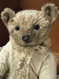 Hug Me Again Collectible bear "Xavier" standing about 11 inch tall.