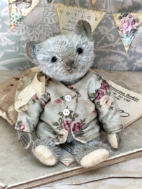 Hug Me Again Collectible bear "Tiny Stella" standing about 6 inch tall.