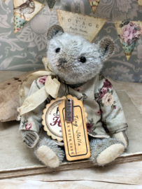 Hug Me Again Collectible bear "Tiny Stella" standing about 6 inch tall.