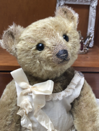 Hug Me Again Collectible bear "Calla" standing about 9 inch tall.