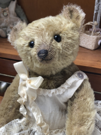 Hug Me Again Collectible bear "Calla" standing about 9 inch tall.