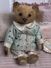Hug Me Again Collectible bear "Pokkie" standing about 6 inch tall.