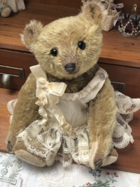 Hug Me Again Collectible bear "Calla" standing about 9 inch tall.