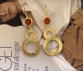 Oorbellen gouden cirkels cateye stone oranje