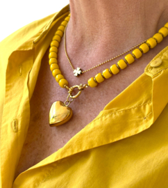 Ketting glaskralen geel /hart goud