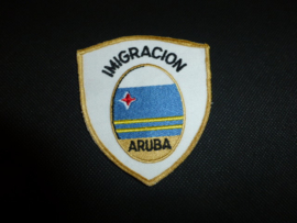 Mouwembleem Imigracion Aruba