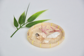 Wooden bowl with flowers and shells