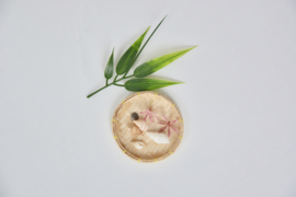 Wooden bowl with flowers and shells