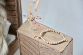 Hanger with wooden beads
