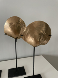 Gold coloured oyster on stand