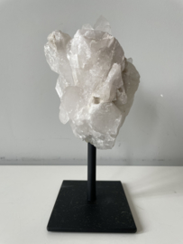 Rock crystal on black metal stand