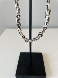 Batik bone beads necklace on metal stand