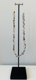 Batik bone beads necklace on metal stand